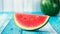 Watermelon slice popsicles on a blue rustic wood background. Selective focus