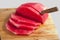 Watermelon sliced on cutting board