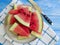 Watermelon slices natural, nutritious yummy towel freshness sweet summertime on a blue wooden background