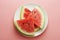 Watermelon slices in plate isolated onpink background. Summer foods. Isolated