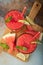 Watermelon slushie with lime, summer refreshing drink in tall glasses on a blue rusty background. Top view