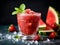 Watermelon strawberry sorbet with mint leaf on dark background, close up. Freshly blended iced strawberry and watermelon smoothie