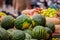 Watermelons, melons, vegetables and fruits at a street market in the city