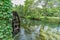 Watermill by Sai river near Daio Wasabi Farm in Azumino, Nagano Prefecture, Japan.