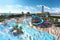 waterpark with massive water slide and towering drop, in the midst of a bustling crowd