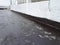 Waterproof coatings applied on flat roof concrete surfaces.