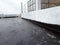 Waterproof coatings applied on flat roof concrete surfaces.