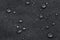 Waterproof droplets on fabric. Black Canvas Polyester texture synthetical for background. Black polyester textile backdrop for