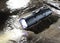 Waterproof tactical flashlight on a rock