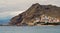 Waterside distant view to Playa de Las Teresitas beach picturesque famous place for tourists, hillside town houses mountainous