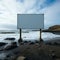 Waterside emptiness Billboard against sandy shore, overlooking the vast sea