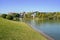 Waterside lawn and houses in sunny winter afternoon