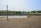 Waterside planked platform in city at sunny summer noon