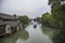 Watertown. Channel with buildings on water. Zhouzhuang,