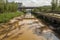 waterway with dangerously high levels of pollutants and chemicals, threatening the aquatic ecosystem