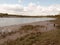 A Waterway River Through the UK with Low Tide and Birds Wading i