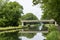 Waterways in Belgium, manmade canal with oak trees alley