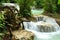 Waterwheel and cascades of Kuang Si Waterfalls, Luang Prabang, Laos