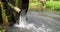 Waterwheel rolling splash water in the nature countryside