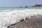 Wave on beach near Aphrodite stone. Cyprus.