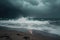 wave breaking on beach in stormy weather, with lightning in the distance