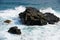 Wave breaking down to splashes at the shore rocks at Gris-Gris, Mauritius island.