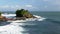 Wave breaking in front of tanah lot temple on bali