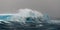 Wave breaking over huge tabular iceberg, Southern Ocean, Antarctica