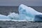 Wave breaking over an iceberg