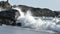 Wave breaking on the rocks of the Pacific ocean coastline slow motion