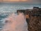 Wave crashes on rock coast line, Mini cliffs county Clare, Ireland, Concept power of Nature, Sunset time