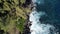 wave crashing against lava cliffs at MacKenzie State Recreation Area, HAWAII