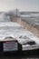 Wave crashing over harbour wall