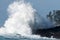 Wave crashing on a rocky coastline in Big Beach, Ucluelet, Vancouver Island, BC Canada