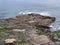 The wave cut platform of Sletts Pier in Lerwick, Shetland, UK