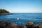 Wave from Lake Superior splashes on the rocky North Shore in Minnesota