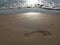 Wave on the sand beach - footprint