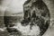 Wave splash on rock cliff in Sorrento, Italy. Blackand white seascape