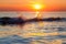 Wave Splash at Sunset on Lake Michigan