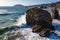 Wave Striking a Large Rock Along California Coastline