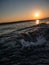 Wave in the sunset over the adriatic sea at the Croatian coast. Oblique dynamic horizon