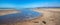 Wave tide overflow into tide pool on Surfers Knoll beach in Ventura California USA