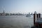 Waveless calm water surface and Hamburg harbor skyline with modern buildings along the Elbe river