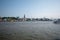 Waveless calm water surface and Hamburg harbor skyline with modern buildings along the Elbe river