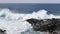 Waves from the Atlantic ocean breaking on the rocky volcanic beach of Lanzarote