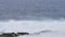 Waves from the Atlantic ocean breaking on the rocky volcanic beach of Lanzarote