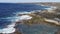 Waves from the Atlantic ocean breaking on the rocky volcanic beach of Lanzarote