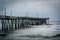 Waves in the Atlantic Ocean and the Fishing Pier in Virginia Beach, Virginia.