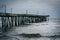 Waves in the Atlantic Ocean and the Fishing Pier in Virginia Beach, Virginia.