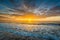 Waves in the Atlantic Ocean and sunrise, in Isle of Palms, South Carolina